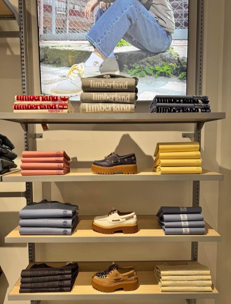 Footwear and folded apparel on the Timberland shelving in Chile.